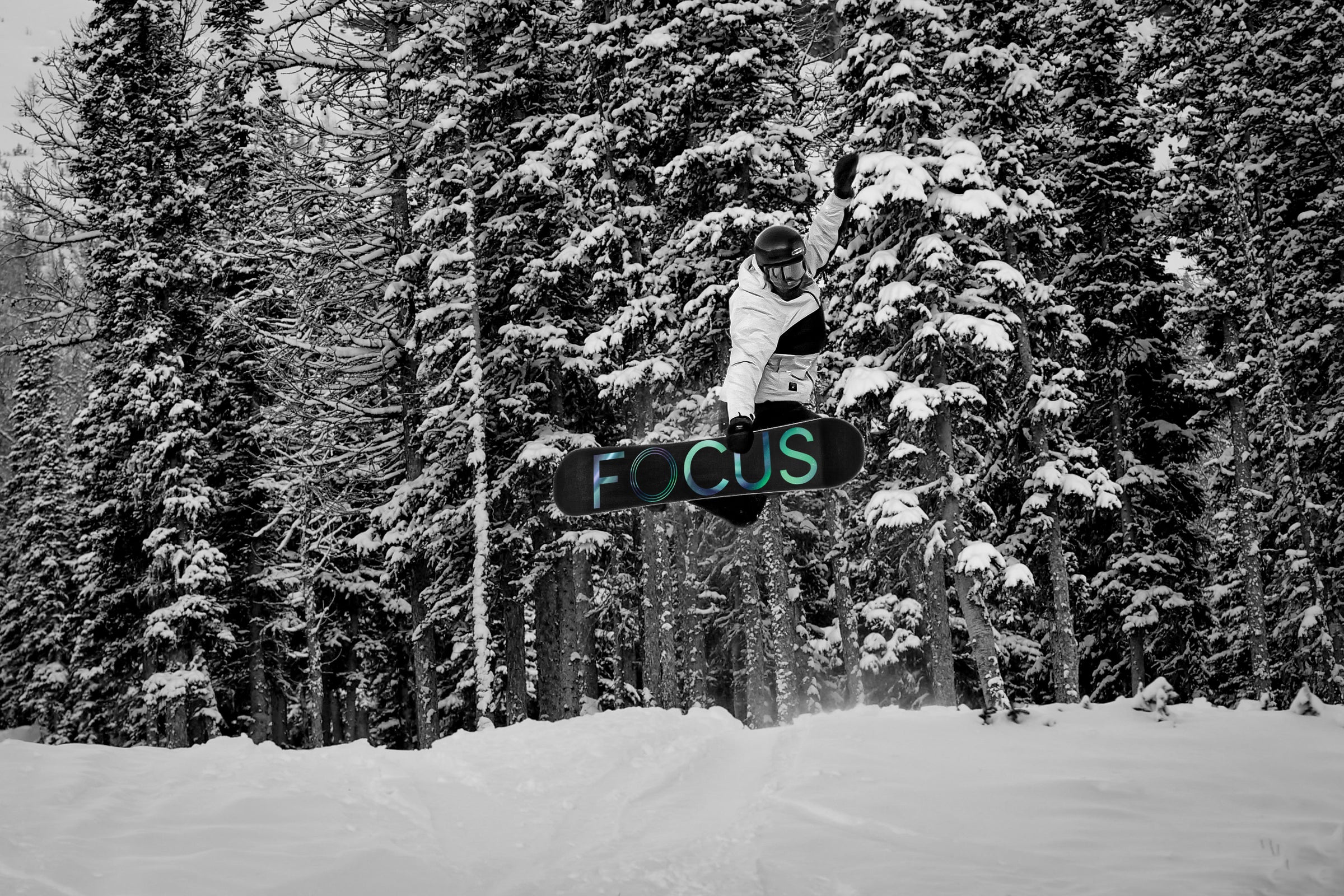 method grab on the Reason, the best all mountain snowboard in the Rockies with Focus Snowboards, Banff's first snowboarding company.